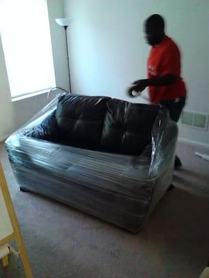 In the process of shrink wrapping a leather couch