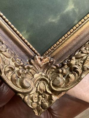 Several huge pieces of the frame missing and cracks every where.