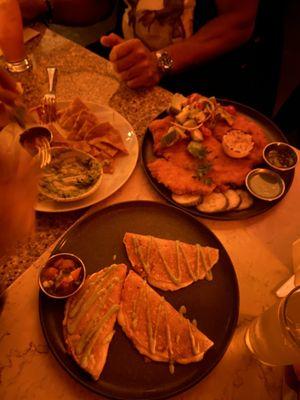 Cheese quesadillas, carne asada tacos, fish tacos, chicken milanesa, arugula salad and truffle fries. So so good thank you Gigi