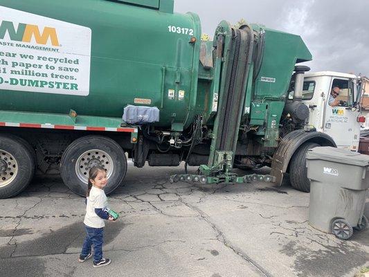 Our amazing garbage man and my son.