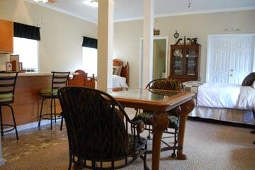 1st floor guest suite:  kitchen w/bar, queen/twin beds, dining area, full bath, and laundry area.