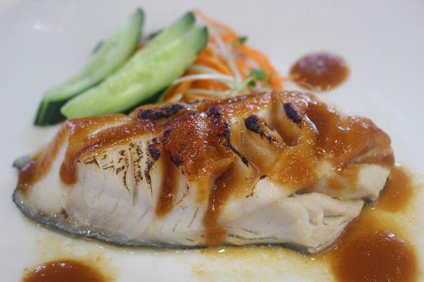 Miso Butterfish is an Alaskan black cod fillet that's marinated with their house made miso glaze and broiled with cucumber garnish.