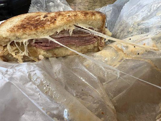 Ooey gooey Swiss cheese, juicy corned beef, tangy sauerkraut with awesome Russian dressing. See my review