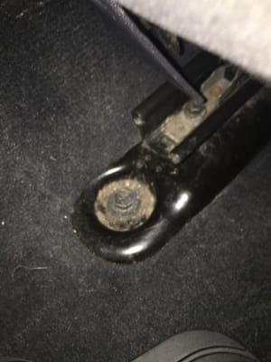 yuck! driver seat floor bolts as seen from back seat- was no cleaned it wiped down