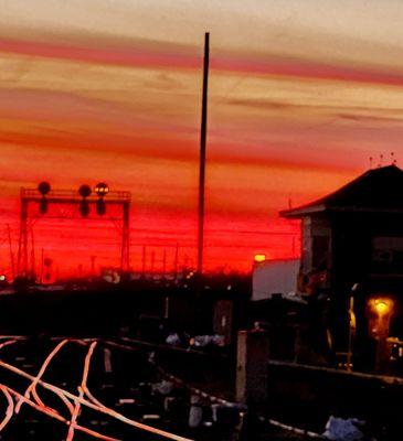 The Trains on the tracks Go Clickery Clack during red sundown rush hour 11.8.23