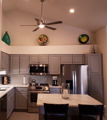 Cabinets painted, fan replacement, sink and faucet replaced, and backsplash installed