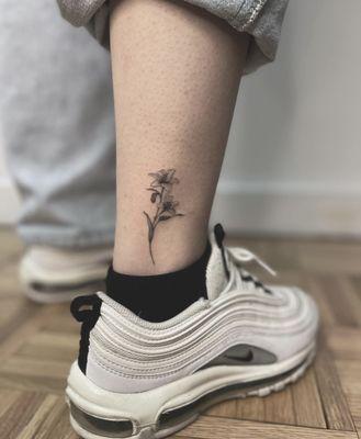 Lily tattoo done by artist 'Jin'- @i_am_fine_newyork