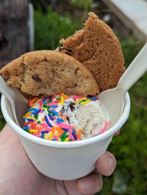 Scoop cookies and cream with sprinkles and cookies added