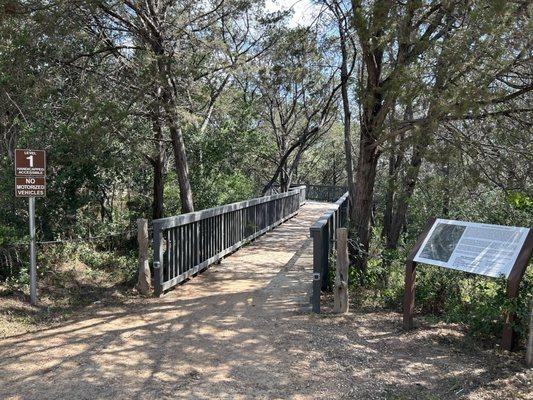 Short wooden bridge leading to Stage Stop Park