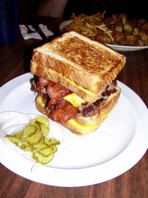 This is what their Grilled Cheese double bacon burger looks like! It was so huge I had to use a knife and fork to eat it!