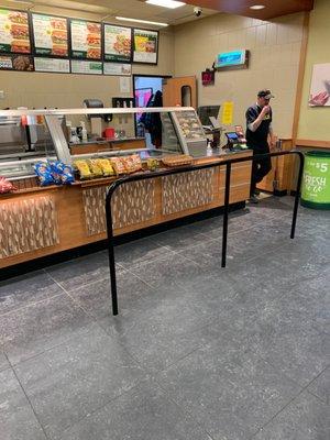 Guy eating bacon as he abandons the counter.