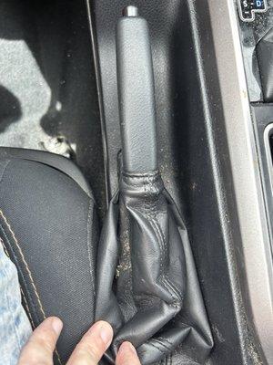 Dirt left inside e-brake cover