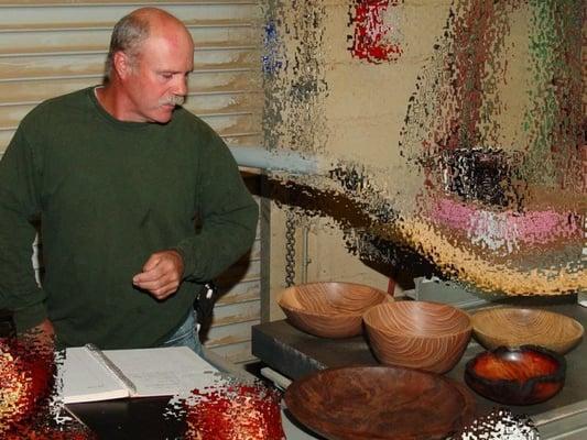 Owner Darren w his carved bowls