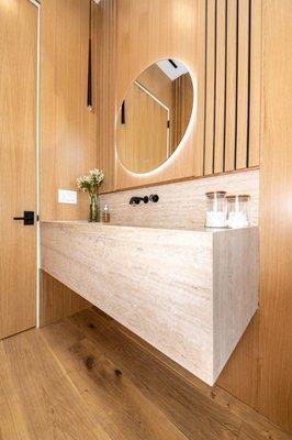 Modern bathroom remodeling with wood covering, LED mirror and beautiful vanity.