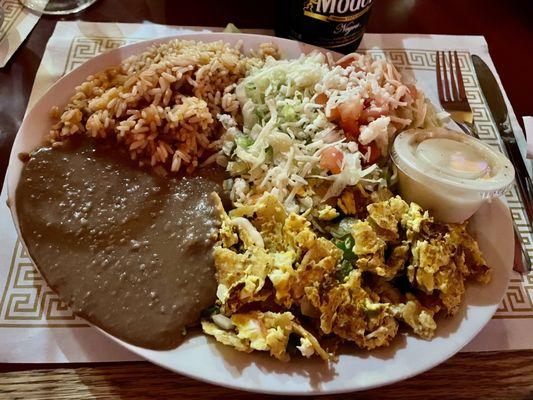 Chilaquiles. The refried beans are beautifully smoky, but the eggs were overcooked. There is a lot here to like, though.