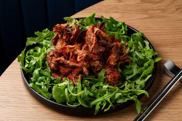 Fried Oyster Mushrooms on top of Champagne Vinegared Arugula Salad