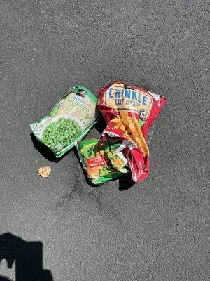 Bags of frozen food on driveway....why?