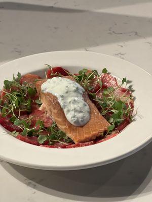 Carpaccio's oven roasted beets with smoke salmon smothered with jalapeño yogurt and micro arugula.