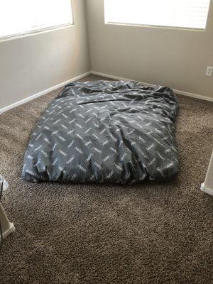 Queen bean bag chair laid out as a mattress