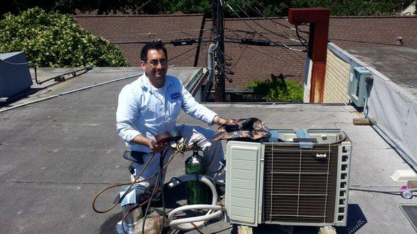 Repairing a residential air conditioning unit.