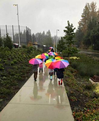 When the weather turns wet, Teacher Steffeny sometimes leads rain walks for pre-k students.