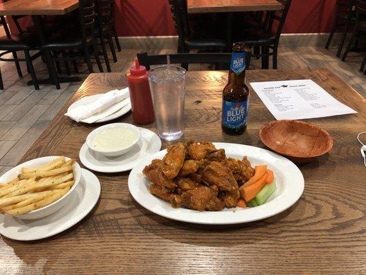 Wings and fries topped off with a Blue Light!