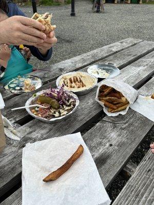 Fries, hummus and falafel and shawarma plate (some already eaten, we were hungry!)