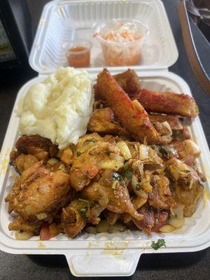 Chicken, mashed potatoes, and fried yuca. Huge serving of chicken that's super tasty and tender.