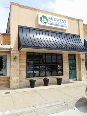 Front exterior of Midwest Family Health pharmacy in Plainville, KS.