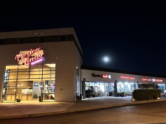 Outside with the OLD sign still up. A full moon and tranquil kind of day.