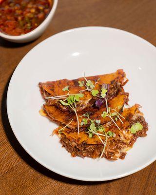 Birria tacos served with consome