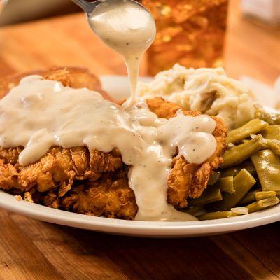 Country fried chicken: Hand-battered on Texas toast with gravy. Served with mashed potatoes and southern green beans.