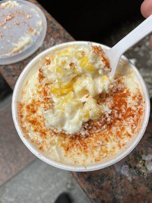 Elote (fresh roasted corn with butter, sour cream, cheese and Tajin spice)