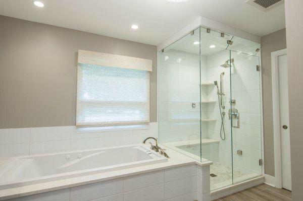 Frameless steam shower with transom.