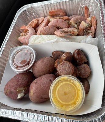 Royal reds, red potatoes, sausage and corn. Butter sauce and cocktail sauce for dipping.