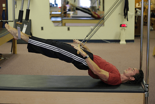 Jeff Prall on the cadillac doing breathing with the barre