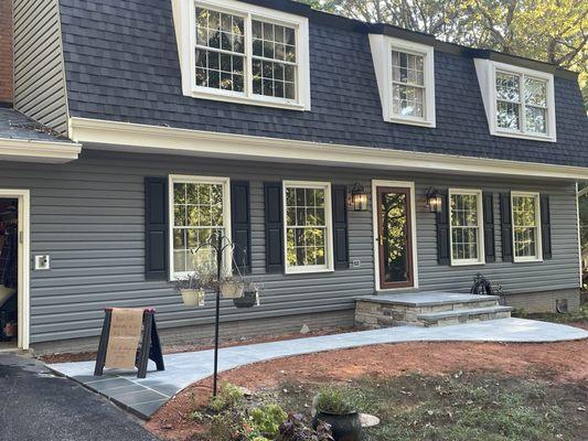 New. Front stoop and flagstone walkway.