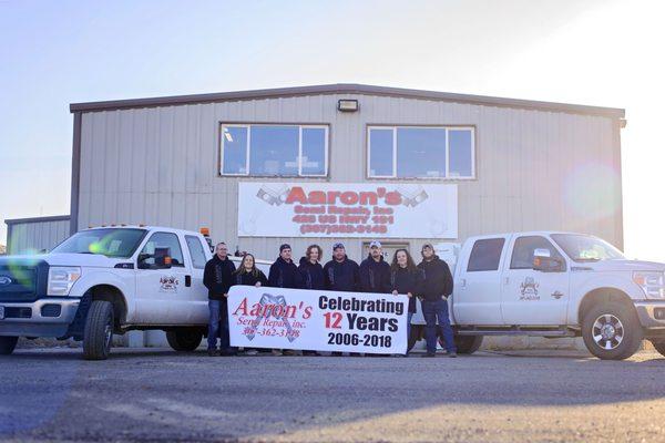 Team in front of shop