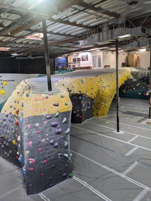 Yoga/fitness class studio all the way in the back corner on the top floor, only accessible by bouldering up.