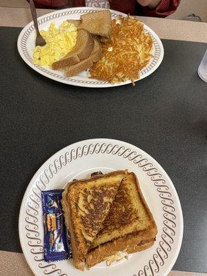 Breakfast sandwich and egg and hash browns.