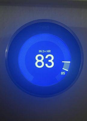 Nest thermostat showing an air conditioner not cooling down a residential home