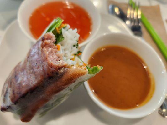 Nem Nuong (grilled meaballs) roll with fish and peanut sauces (2 rolls for $10)