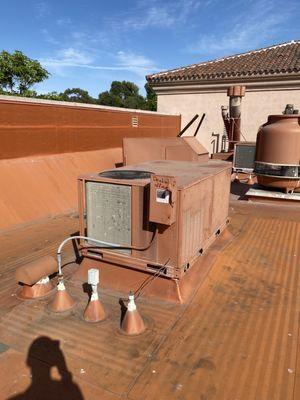 Blower motor, belt, pulley, capacitor, contactor and fuses replaced on old Carrier rooftop heat pump unit for dental office in Newport beach