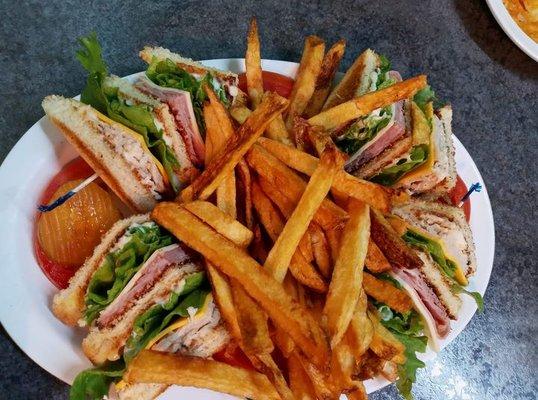 Club sandwich with fries