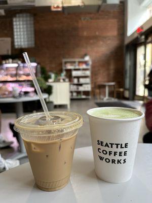 Iced hazelnut latte with regular milk and hot matcha latte with oat milk