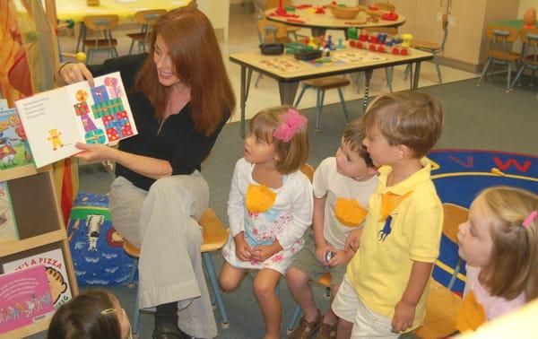 Reading Time. A pre-reading teacher works with Pre-K children introducing the alphabet and phonics with various activities.