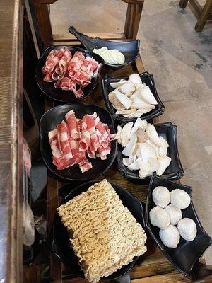 Hotpot beef, fish balls, ramen noodles, mushrooms, and egg tofu