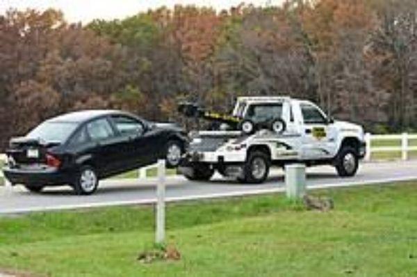 Tow truck w/ car