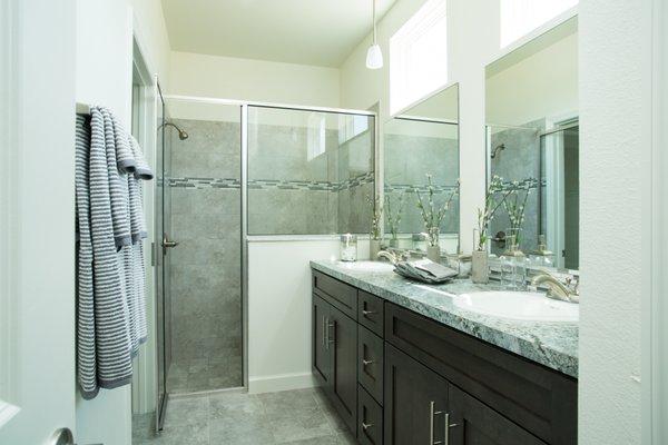 Master Bathroom // double sink, plenty of storage space, walk-in shower, transom windows for natural light.