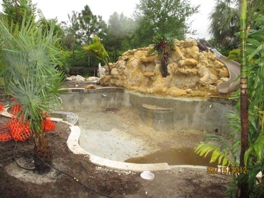 Rock waterfall with slide for a swimming pool  Resort Style Waterfall   Boynton Beach, West Palm Beach, Wellington, Jupiter